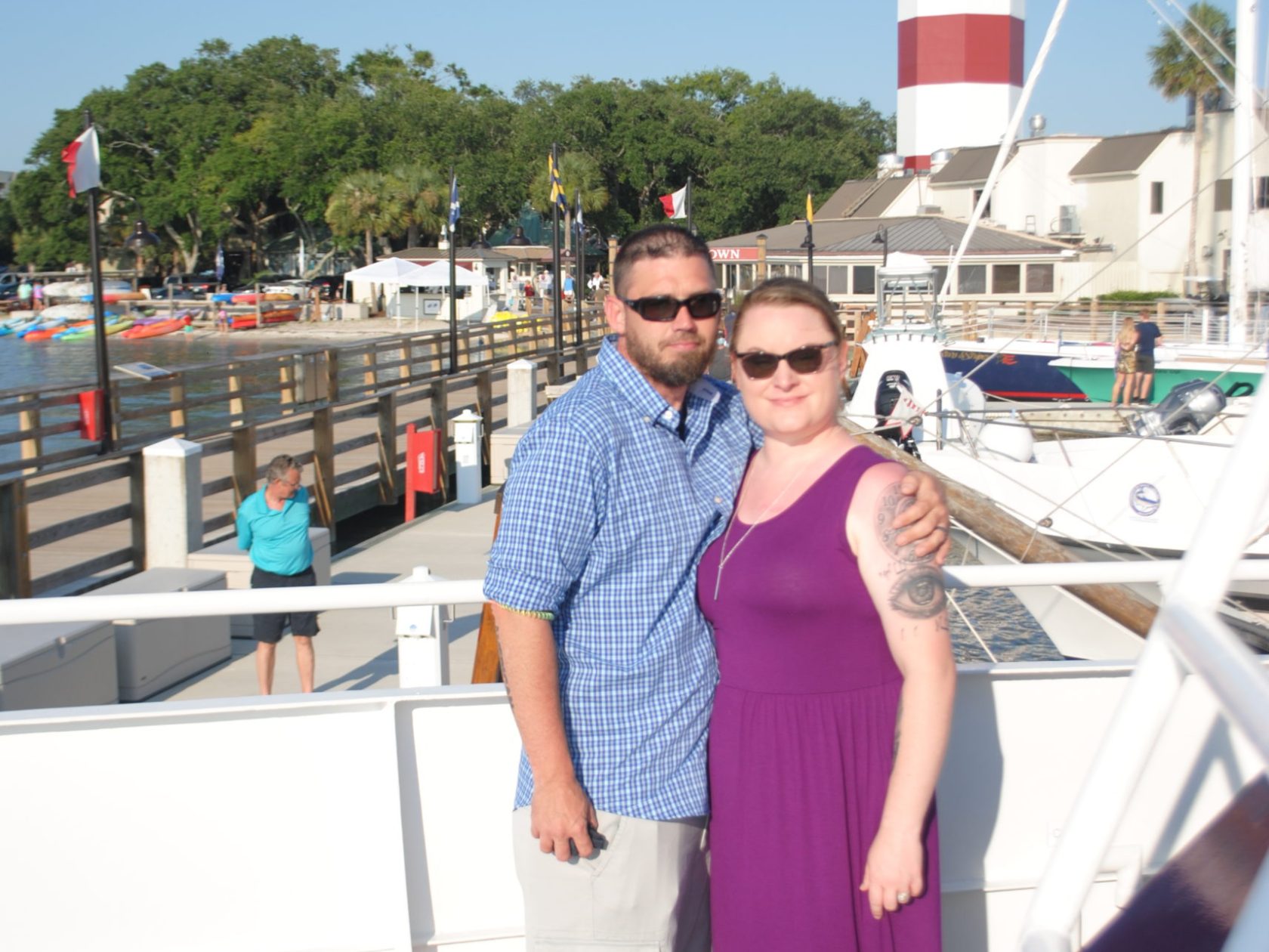 a person standing in front of a large ship in the background