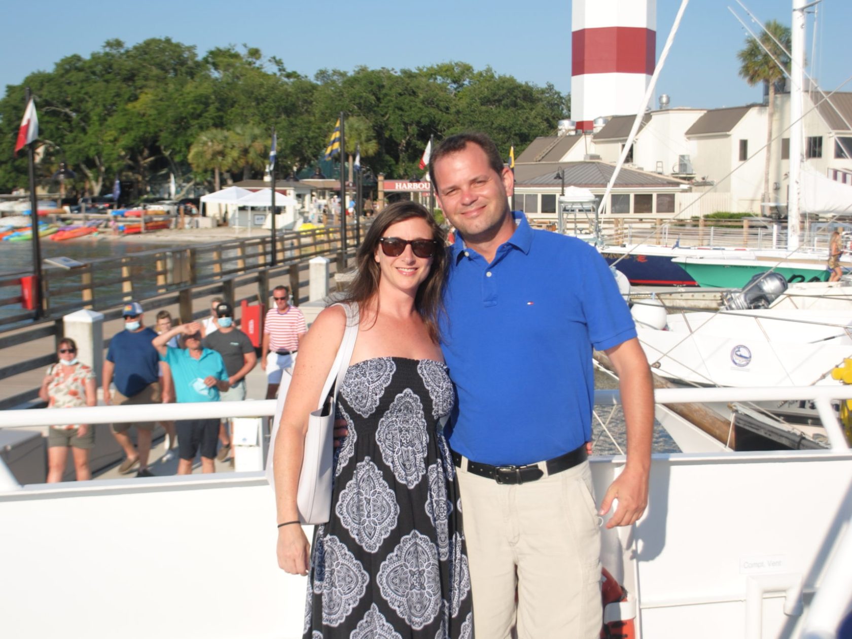 a man standing next to a boat