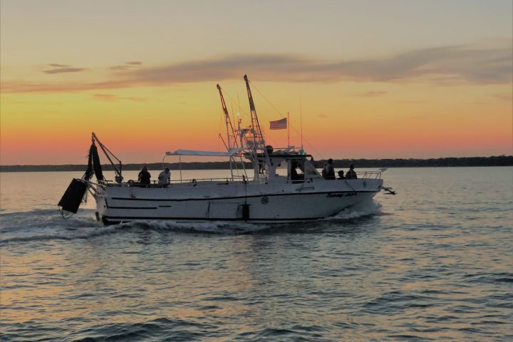 a small boat in a large body of water