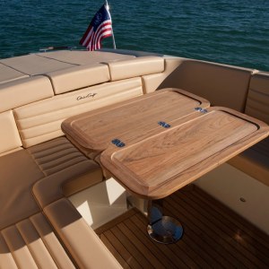 a boat sitting on top of a wooden chair