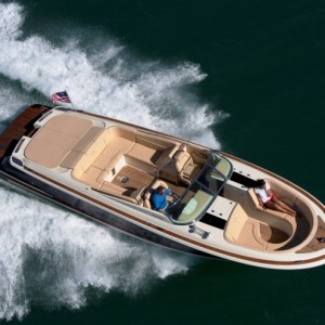a person riding a wave on top of a boat